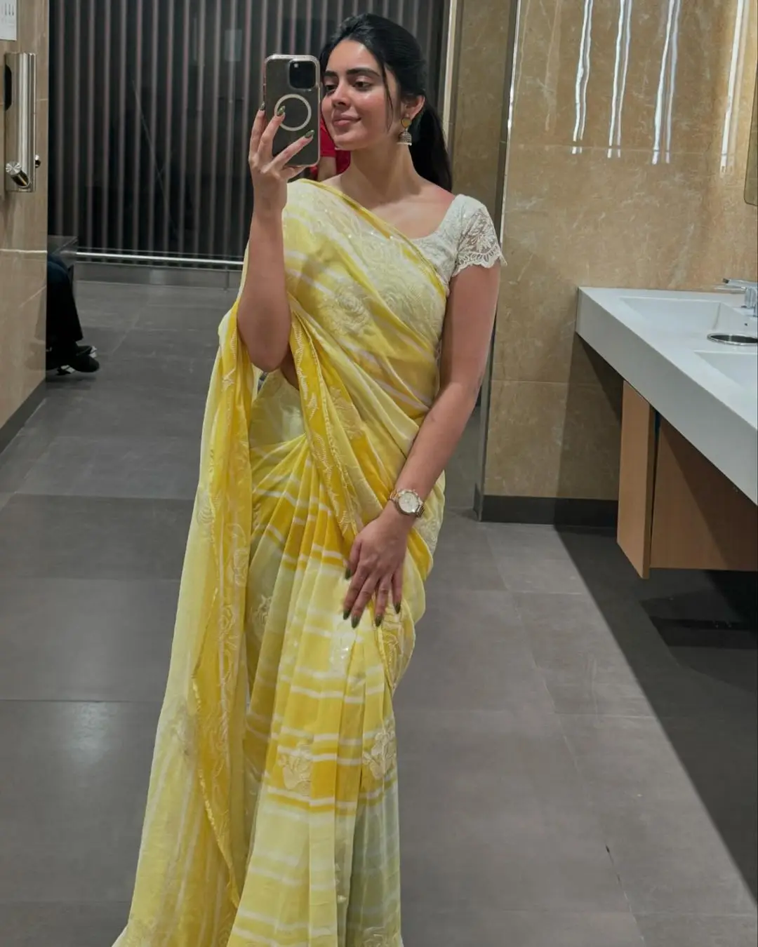 Kushita Kallapu In Traditional Yellow Saree White Blouse